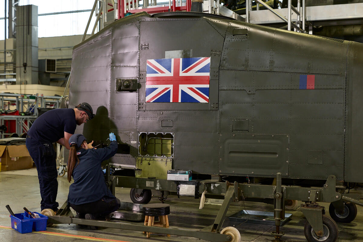 Aircraft maintenance technician apprentices at working on a Royal Air Force Chinook at Middle Wallop