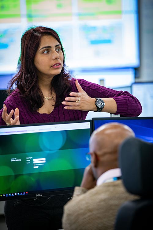 People in an office talking