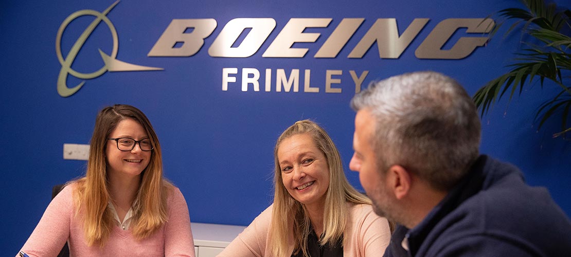 Three workers collaborating at Boeing Frimley