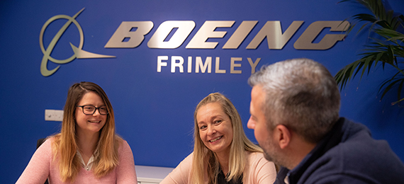 Three workers collaborating at Boeing Frimley